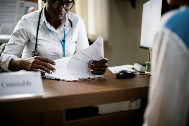 Patient meeting doctor. HMIS reduces time wasted on manual workflows.
